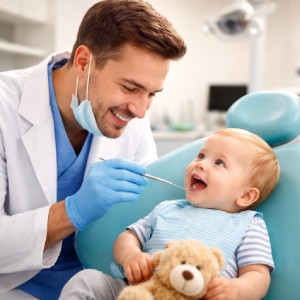 Friendly dentist near me in Monrovia providing gentle dental care to a young child in a comfortable clinic